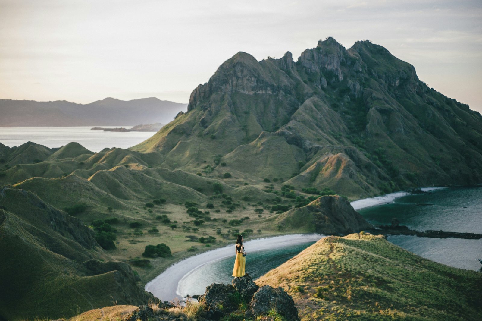 A traveller looking out over Padar Island at sunset